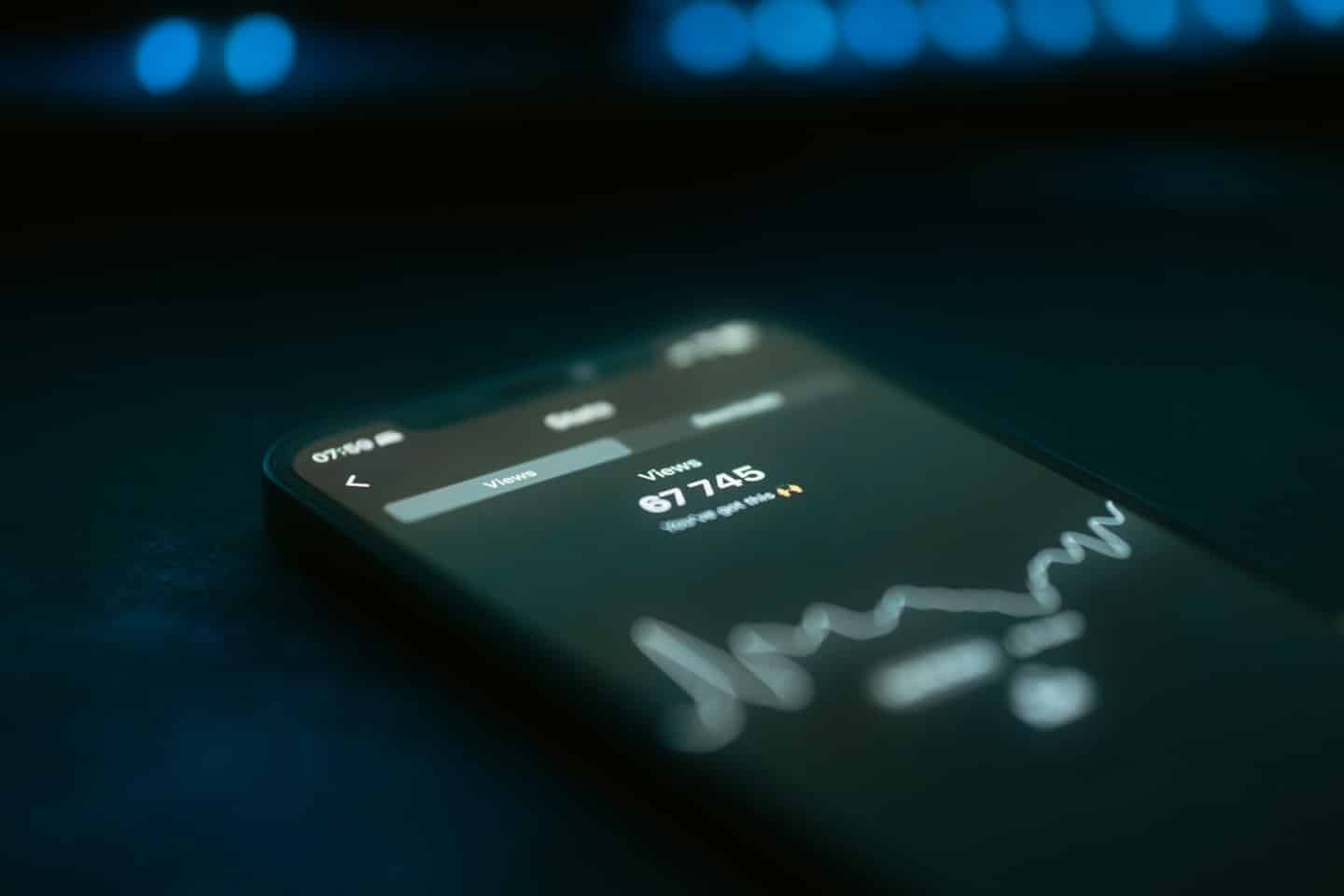 Smartphone screen displaying analytics data and a line graph.